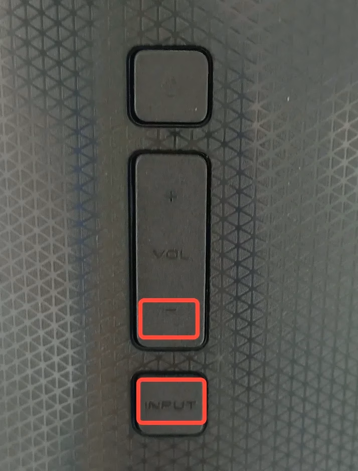 locate the volume down and input buttons