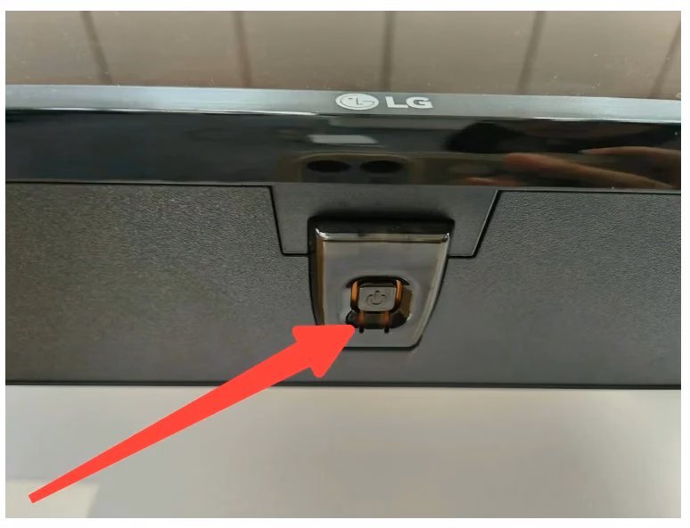 locate the power button on the LG TV